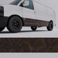 orange topographic vinyl wrap applied to the side of a white van, showcasing bold contour lines on a black background.
