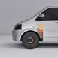 VW Transporter T5 T6 Sunset Mountain Forest Door Decal on silver van side, showcasing mountain and forest design.