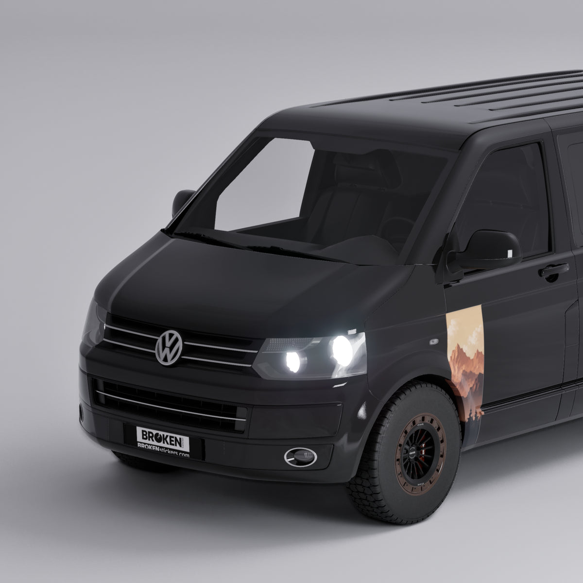 VW Transporter T5 T6 Sunset Mountain Forest Door Decal displayed on black van front view.