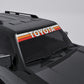 Toyota Retro Stripe Windshield Banner Decal on a black vehicle, showcasing 70s vintage design with bold colors.