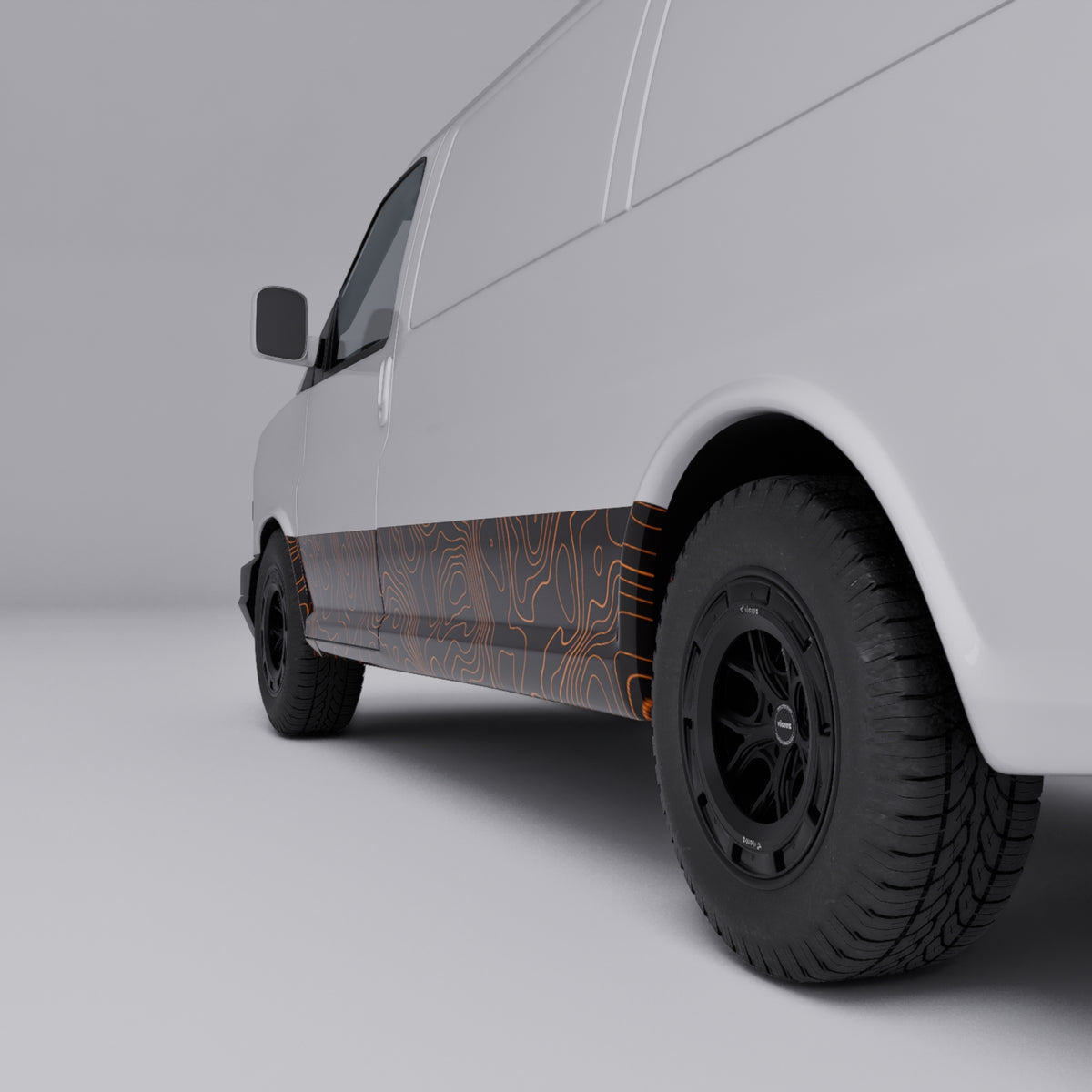 Orange topographic vinyl wrap on a white van showcasing bold copper-orange contour lines.