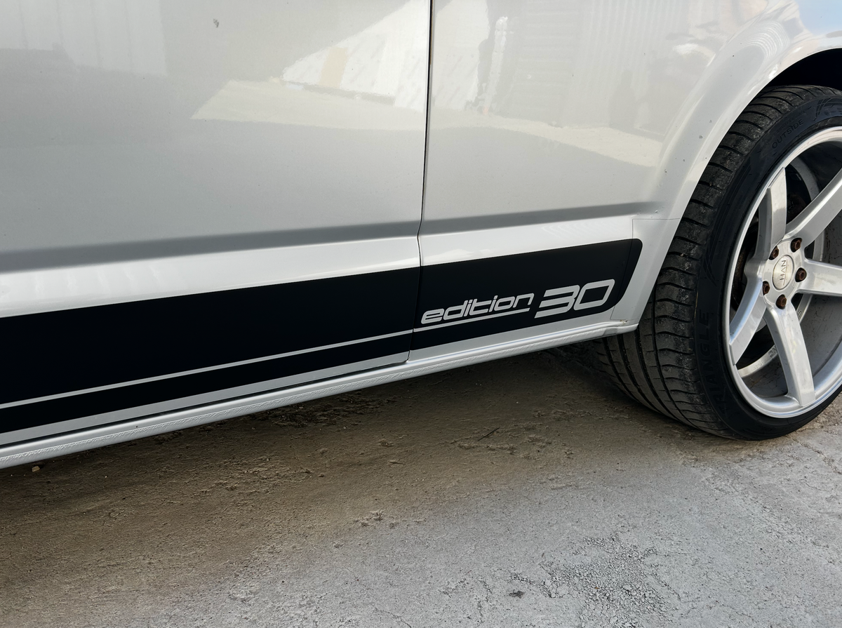 VW Transporter T6 Edition 30 Side Stripe Decal displayed on side of vehicle, showcasing anniversary design.