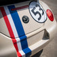 Rear view of VW Beetle with retro racing kit showing bonnet stripe and number roundel