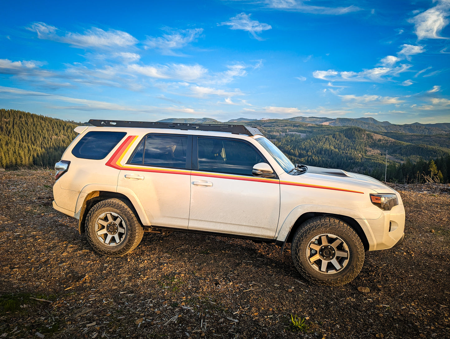 Toyota 4runner offroad in mountains with 40th edition side stripe decals